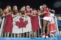 <p>Canadian rugby player Charity Williams hugs her mother Mary Ann Scott after winning a bronze medal. The Canadian sevens rugby team celebrates their win over Great Britain for the first ever bronze medal in women’s rugby at Deodoro Stadium on August 7, 2016 in Rio de Janeiro, Brazil. (Lucas Oleniuk/Toronto Star via Getty Images) </p>
