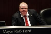 Toronto Mayor Rob Ford shown during a special council meeting at City Hall in Toronto in this November 18, 2013, file photo. Ford, who won global ridicule last year after admitting to having used crack cocaine, registered on January 2, 2014, for the October mayoral election, saying he was the best mayor Canada's largest city has ever had and would be re-elected. REUTERS/Aaron Harris/Files (CANADA - Tags: POLITICS)