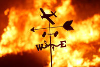 A weather vane is pictured on a ranch during the Creek Fire in the San Fernando Valley north of Los Angeles, in Sylmar, California. REUTERS/Jonathan Alcorn