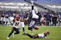 Baltimore Ravens tight end Mark Andrews (89) is upended by Cincinnati Bengals free safety Jessie Bates, right, after making a catch during the first half of an NFL football game, Sunday, Oct. 11, 2020, in Baltimore. (AP Photo/Gail Burton)