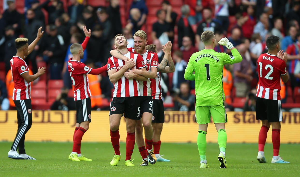 Sheffield United's Jack O'Connell (centre left) and Sheffield United's Oliver McBurnie (centre right) celebrate after the final whistle Sheffield United v Crystal Palace - Premier League - Bramall Lane 18-08-2019 . (Photo by  Nigel French/EMPICS/PA Images via Getty Images)