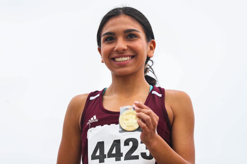 Sinton's Zerah Martinez holds up a first place medal after winning the 4A girls race at the UIL Region IV Cross Country Championships at Dr. Jack Dugan Family Soccer and Track Stadium in Corpus Christi, Texas on Monday, Oct. 24, 2022. Martinez notched a time of 11:26.89, lifting the team to a third place finish and ticket to the state championships.