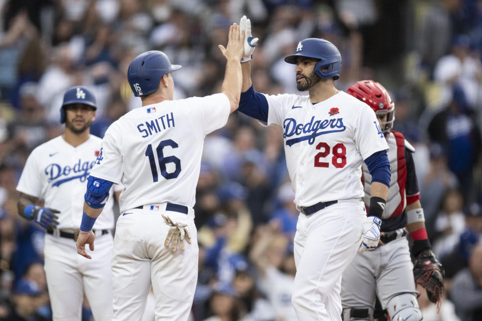 Los Angeles Dodgers designated hitter J.D. Martinez (28) celebrates after his three-run home run with Will Smith (16) during the fifth inning of a baseball game against the Washington Nationals in Los Angeles, Monday, May 29, 2023. (AP Photo/Kyusung Gong)