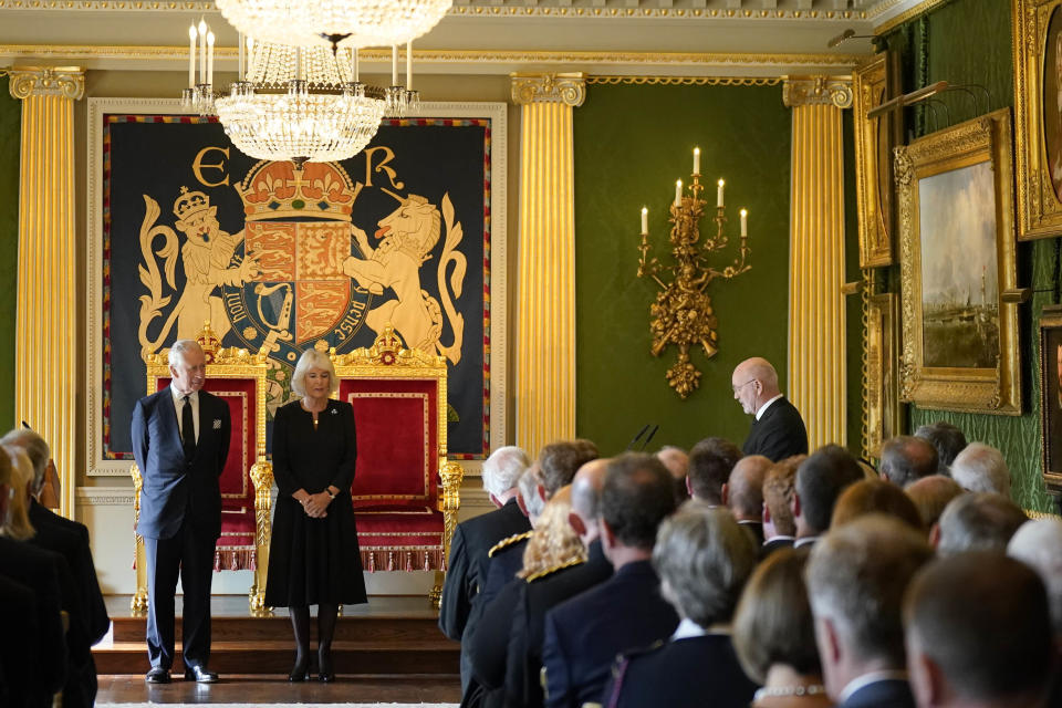 Britain's King Charles III, with the Queen Consort, listen to a message of condolence from Alex Maskey, Speaker of the Northern Ireland Assembly, right, at Hillsborough Castle, Belfast, Tuesday Sept. 13, 2022, following the death of Queen Elizabeth II. King Charles III and Camilla, the Queen Consort, flew to Belfast from Edinburgh on Tuesday, the same day the queen’s coffin will be flown to London from Scotland. (Niall Carson/Pool via AP)