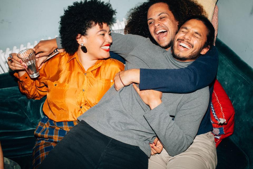 group of young people at a party taking photos