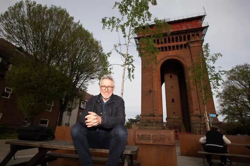 Griff Rhys Jones OBE in front of the Jumbo water tower in Colchester