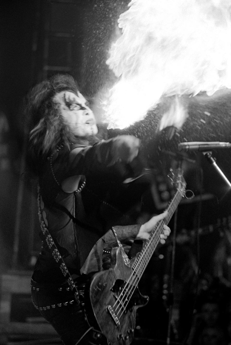 Simmons blows fire onstage at Georgia Tech, December 1, 1974. (Photo by Tom Hill/WireImage)