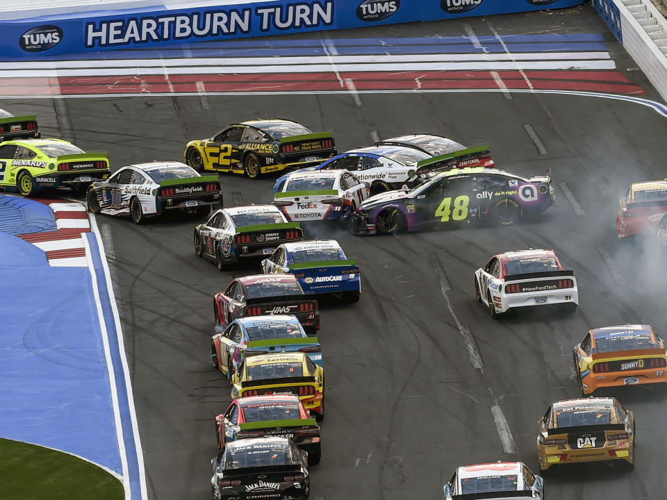 Jimmie Johnson (48) spins going into Turn 1 hitting the cars of Denny Hamlin (11) and Alex Bowman (88) during a NASCAR Cup Series auto race at Charlotte Motor Speedway, Sunday, Sept. 29, 2019 in Concord, N.C. (AP Photo/Mike McCarn)