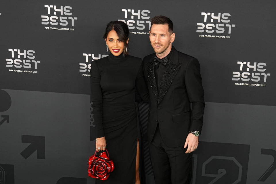 Argentina's Lionel Messi poses with his wife Antonela Roccuzzo on the green carpet before the ceremony of the Best FIFA Football Awards in Paris, France, Monday, Feb. 27, 2023. (AP Photo/Michel Euler)