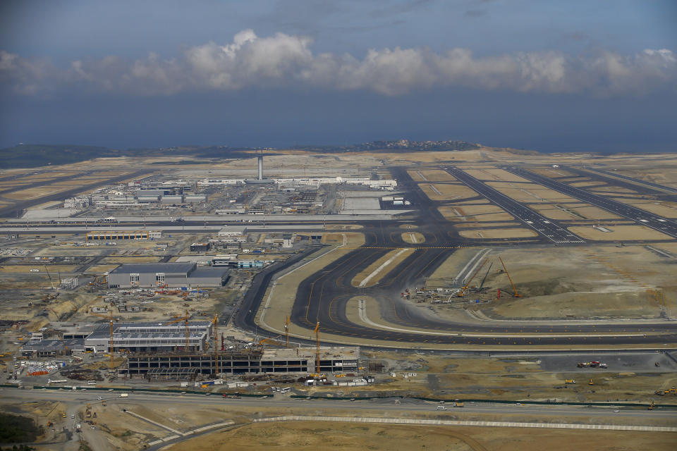 This Sept. 23, 2018, photo, shows an aerial view of Istanbul's new airport ahead of its opening. The first phase of the airport, one of Turkey's President Recep Tayyip Erdogan's major construction projects, is scheduled to be inaugurated on Oct. 29, 2018 when Turkey celebrates Republic Day. The massive project, has been mired in controversy over worker's rights and environmental concerns amid a weakening economy. (AP Photo/Emrah Gurel)