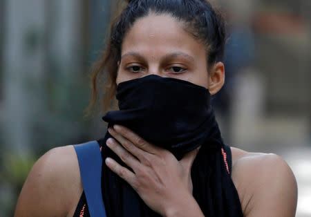 Colombian boxer Dayana Cordero covers her face with a cloth after her practice session ahead of AIBA Women's World Boxing Championships at Indira Gandhi Indoor Stadium in New Delhi, India, November 12, 2018. REUTERS/Anushree Fadnavis