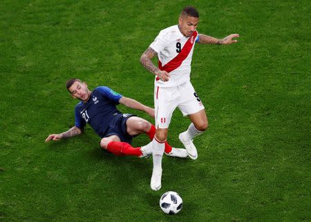 Soccer Football - World Cup - Group C - France vs Peru - Ekaterinburg Arena, Yekaterinburg, Russia - June 21, 2018 France's Lucas Hernandez in action with Peru's Paolo Guerrero REUTERS/Andrew Couldridge