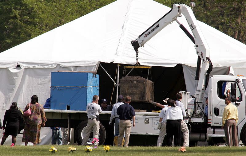 FILE PHOTO: Family members watch as FBI exhumes the body of Emmett Till.