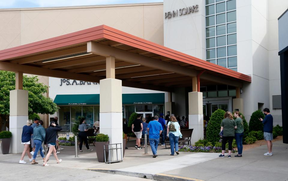 People wait to enter Penn Square Mall on Friday, May 1, 2020, during the re-opening of the mall after being closed because of the coronavirus pandemic.