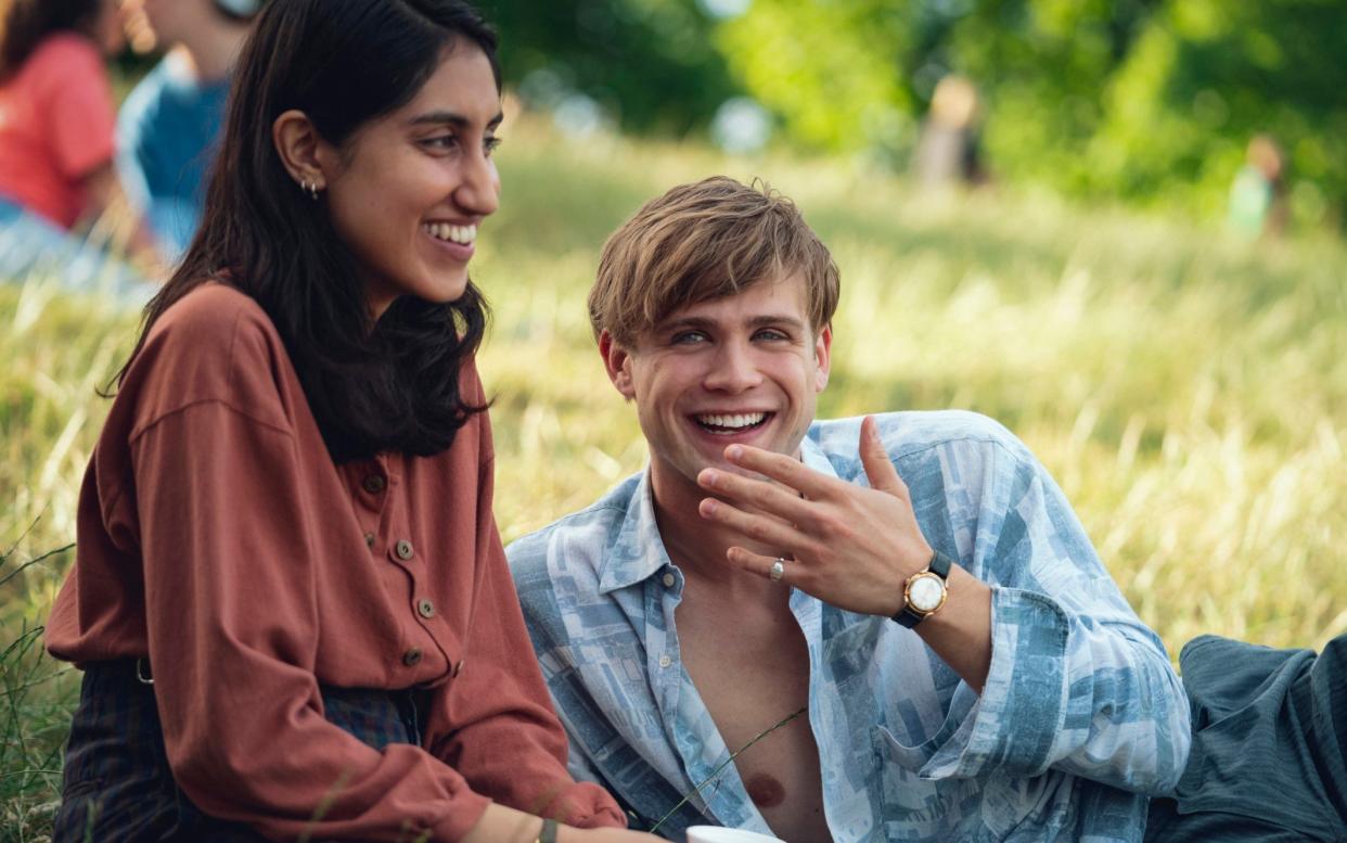 Leo Woodall as Dexter - with Ambika Mod as Emma - in Netflix's One Day, proudly displaying his silver signet ring