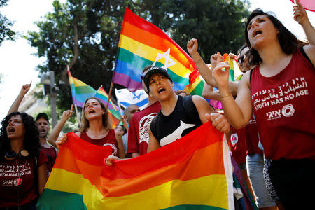 Protestors shout slogans during a LGBT community members protest against discriminatory surrogate bill in Tel Aviv, Israel July 22, 2018. REUTERS/ Corinna Kern
