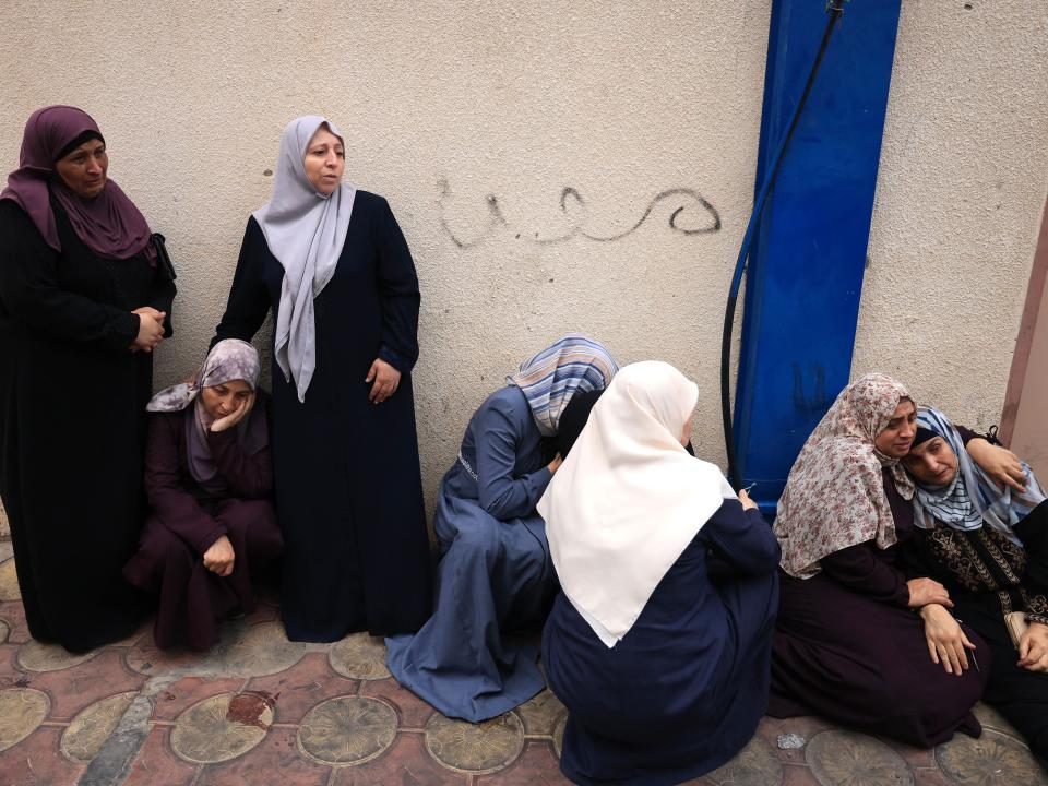 Palestinians mourn the death of their relatives following an Israeli airstrike on the refugee camp of Jabalia in the Gaza Strip on October 9, 2023.