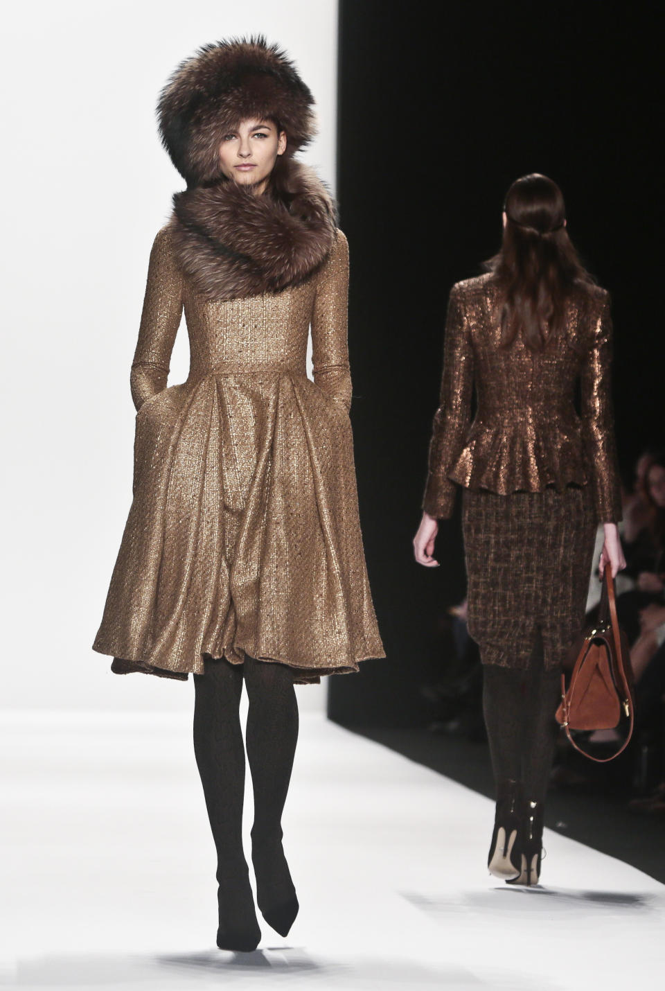 Fashion from the Badgley Mischka Fall 2014 collection is modeled during New York Fashion Week on Tuesday Feb. 11, 2014. (AP Photo/Bebeto Matthews)