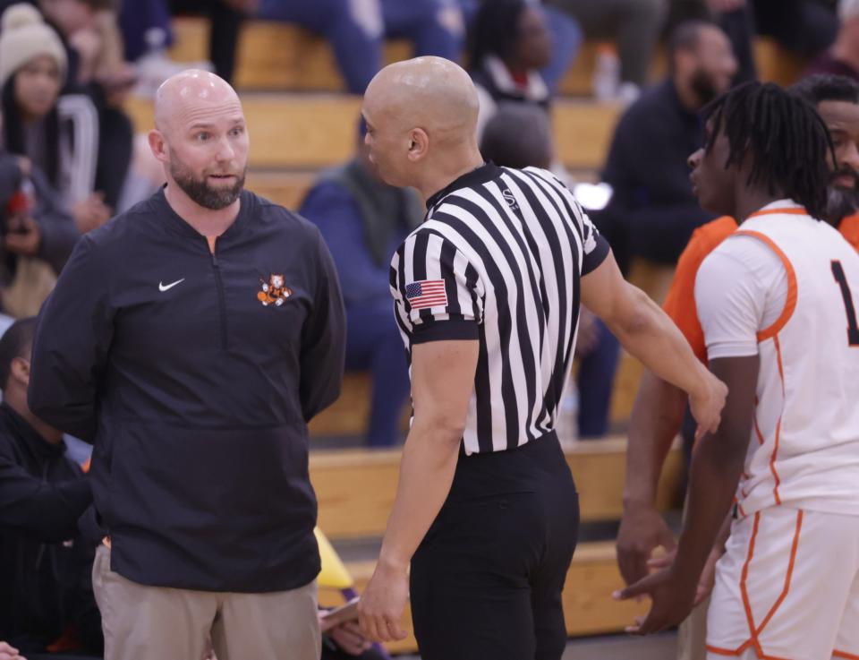 Massillon Tigers boys basketball head coach Josh Hose has words with an official in the second half against St. Vincent-St. Mary High School in an OHSAA district semifinal, Thursday, March 7, 2024.