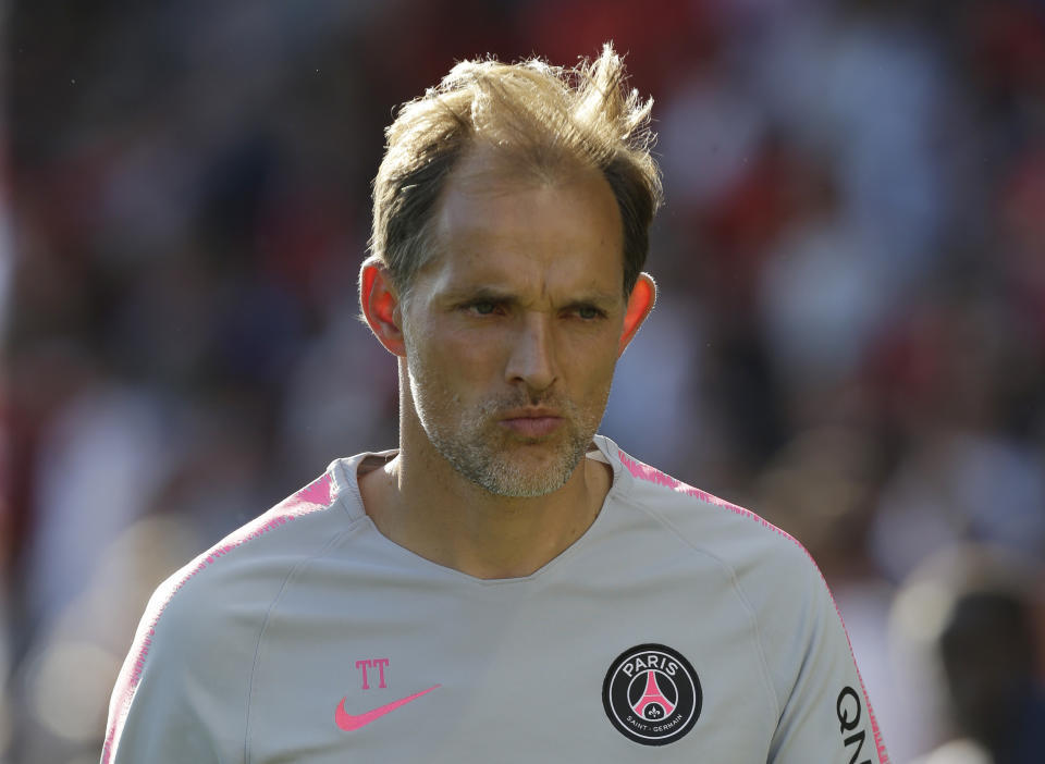 PSG's coach Thomas Tuchel walks out of the pitch after his team won during their League One soccer match between Nimes and Paris Saint-Germain at Jean-Bouin stadium in Nimes, southern France, Saturday Sept. 1, 2018. (AP Photo/Claude Paris)