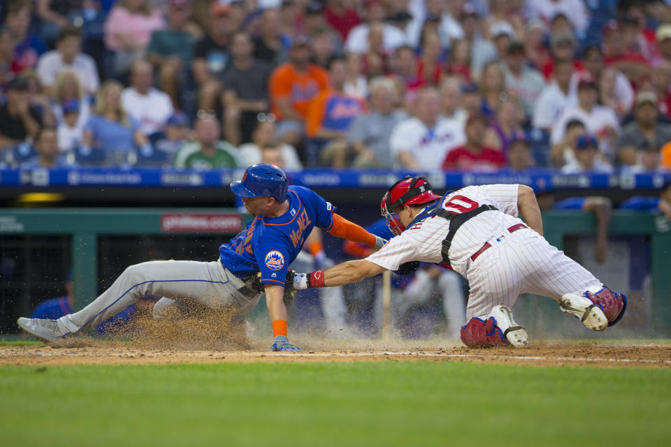 PHILADELPHIA, PA - JUNE 25: J.T. Realmuto #10 of the Philadelphia Phillies tags out Jeff McNeil #6 of the New York Mets in the top of the fourth inning at Citizens Bank Park on June 25, 2019 in Philadelphia, Pennsylvania. (Photo by Mitchell Leff/Getty Images)