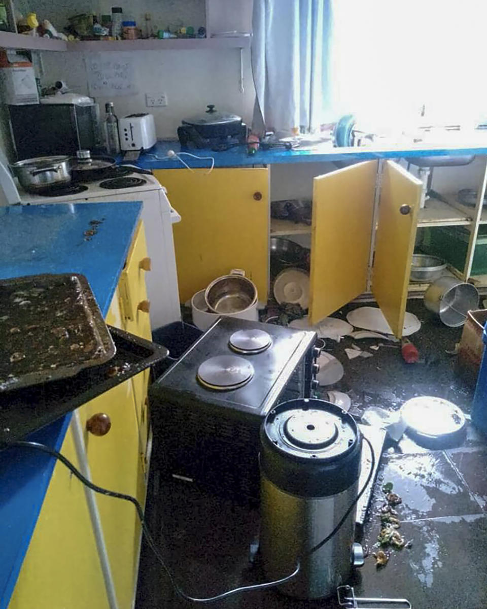 Debris lies strewn across the floor in the kitchen of Renagi Ravu's house in Kainantu, following a strong earthquake in northeastern Papua New Guinea, Sunday Sept. 11, 2022. The U.S. Geological Survey has detected a 7.6-magnitude earthquake in northeastern Papua New Guinea. (Renagi Ravu via AP)