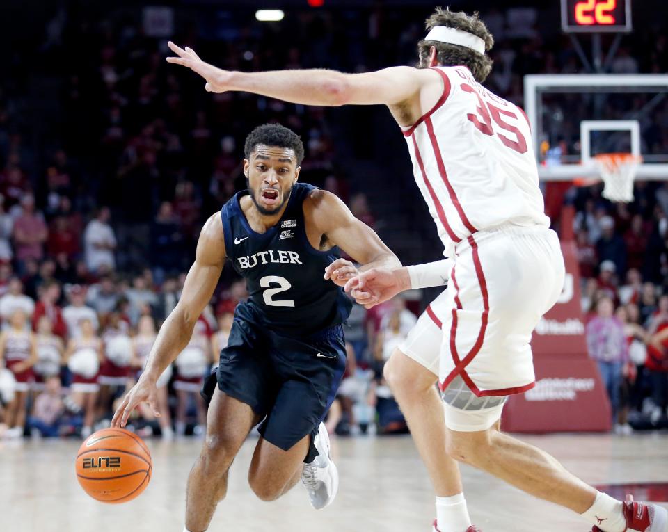Butler's Aaron Thompson looks to get by Oklahoma's Tanner Groves (35) during Tuesday night's basketball game at Lloyd Noble Center in Norman.