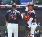 Atlanta Braves starting pitcher Bryce Elder gets a fist pump from catcher William Contreras in the third inning of a spring training baseball game against the Minnesota Twins in North Port, Fla., Friday, March 18, 2022. (Curtis Compton/Atlanta Journal-Constitution via AP)