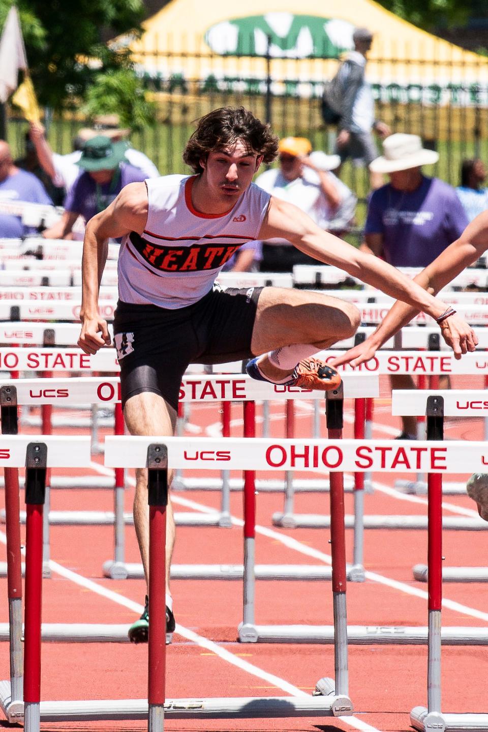 Heath senior Huntyr Butler races in the 110 hurdles during the Division II state championships at Jesse Owens Memorial Stadium on Saturday, June, 4, 2022. Butler ran a time of 14.15 to repeat as champion.