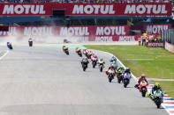 Yamaha MotoGP rider Valentino Rossi of Italy (R) leads the pack during the MotoGP race at the TT Assen Grand Prix at Assen, Netherlands June 27, 2015. REUTERS/Ronald Fleurbaaij