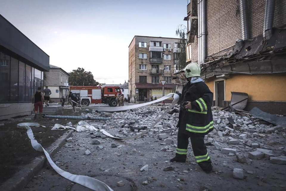 In this photo provided by the Ukrainian Emergency Service, rescuers work on a scene of a building damaged after Russian missile strikes in Pokrovsk, Donetsk region, Ukraine, Monday, Aug. 7, 2023. (Ukrainian Emergency Service via AP Photo)