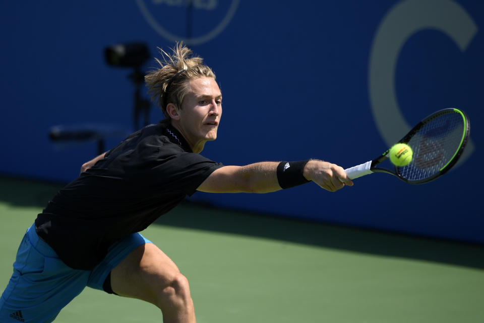 Sebastian Korda reaches for the ball against Jannik Sinner, of Italy, during a match at the Citi Open tennis tournament, Thursday, Aug. 5, 2021, in Washington. (AP Photo/Nick Wass)