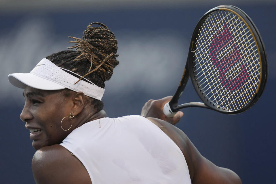 Serena Williams, of the United States, follows through on a return to Belinda Bencic, of Switzerland, during the National Bank Open tennis tournament Wednesday, Aug. 10, 2022, in Toronto. (Nathan Denette/The Canadian Press via AP)