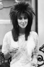 <p>In one of her rock-inspired wigs of the '80s.</p>