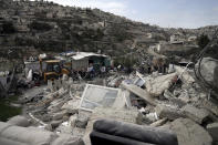 The Ratib Matar family home lies in rubble after it was demolished by Israeli authorities in the Jabal Mukaber neighborhood of east Jerusalem, Sunday, Jan. 29, 2023. For many Palestinians, the accelerating pace of home demolitions is part of Israel's new ultranationalist government's broader battle for control of east Jerusalem, claimed by the Palestinians as the capital of their future state. Israel says it is simply enforcing building regulations. (AP Photo/Mahmoud Illean)