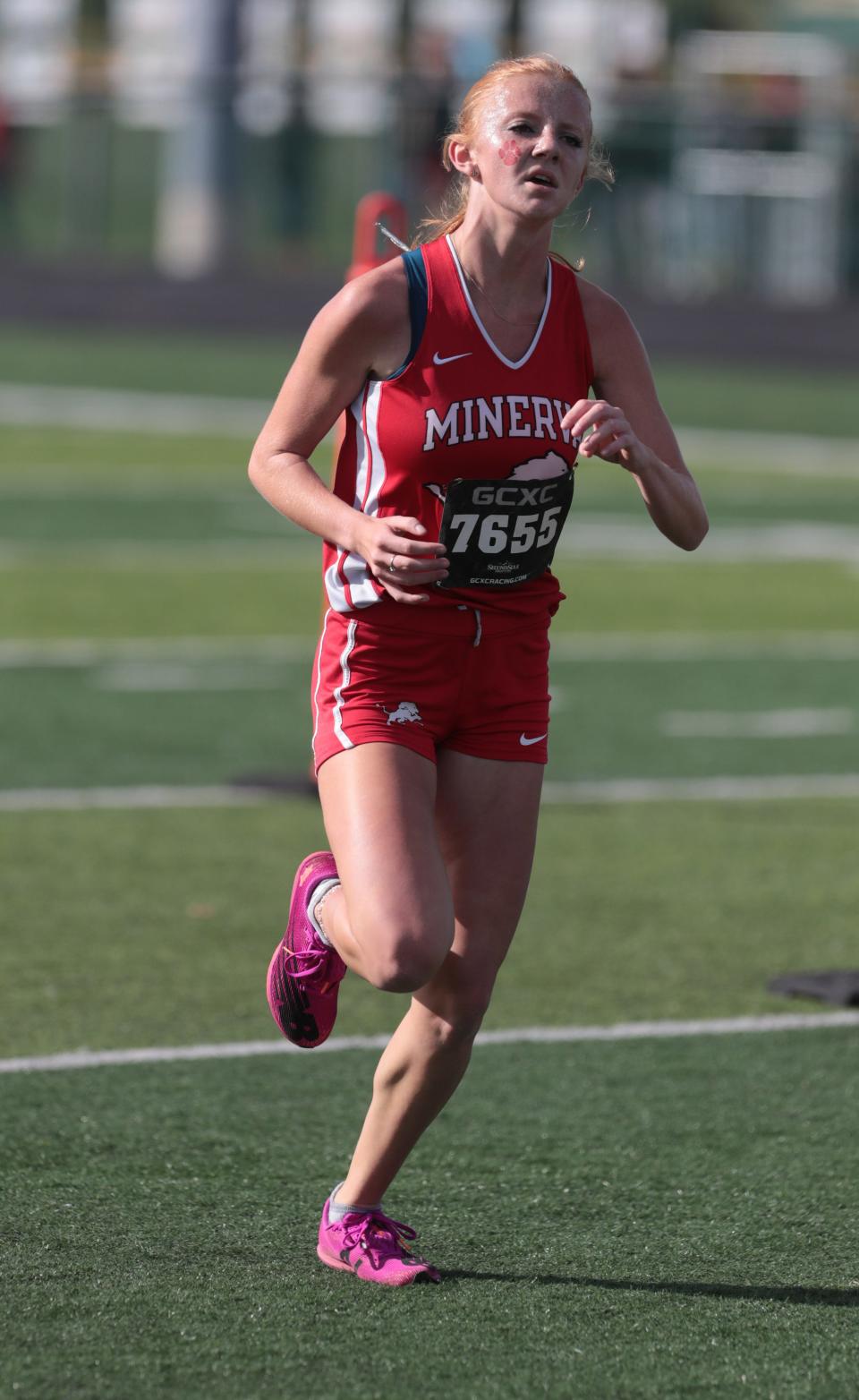 Hera Hoffee leads Minerva to the overall girls team title at Saturday's Stark County Cross Country Championships.