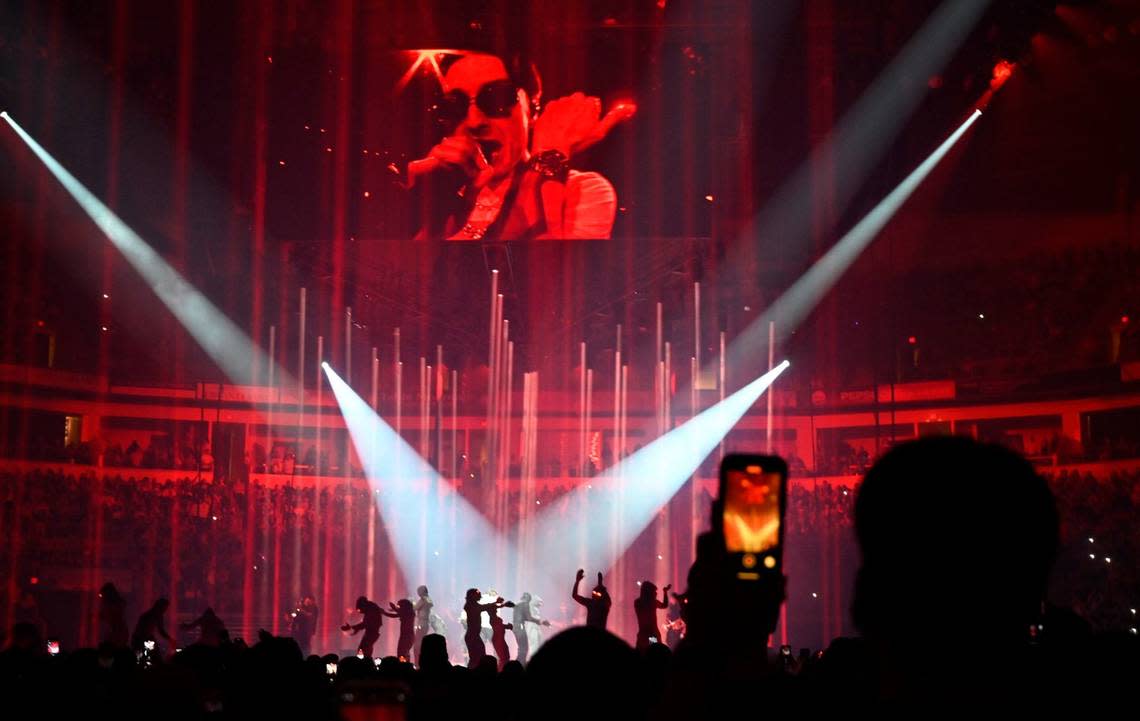 Dancers are illuminated on stage as Peso Pluma brings his Exodo Tour to the Save Mart Center Saturday night, Sept. 7, 2024 in Fresno.