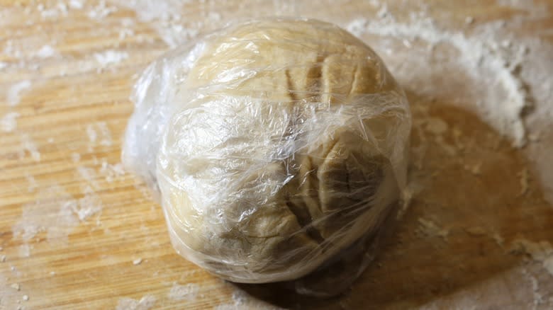 dough wrapped in plastic