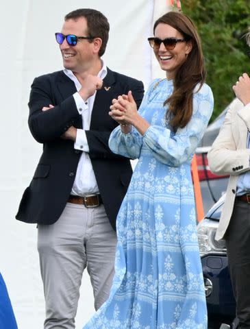 <p>Karwai Tang/WireImage</p> Peter Phillips and Kate Middleton watch the Royal Charity Polo Cup 2023 at Guards Polo Club on July 6, 2023.