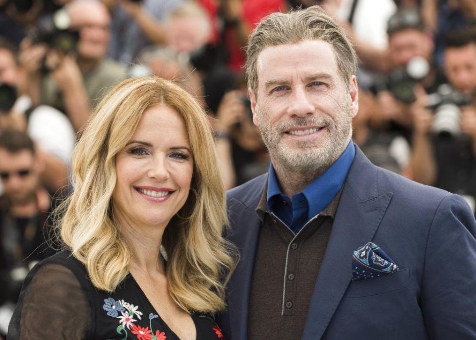 Actors Kelly Preston, left, and John Travolta pose for photographers during a photo call for the film 'Gotti' at the 71st international film festival, Cannes, southern France, Tuesday, May 15, 2018.