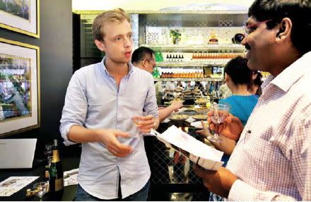 Guests with Etienne Croset (left), business development and marketing associate of The French Cellar