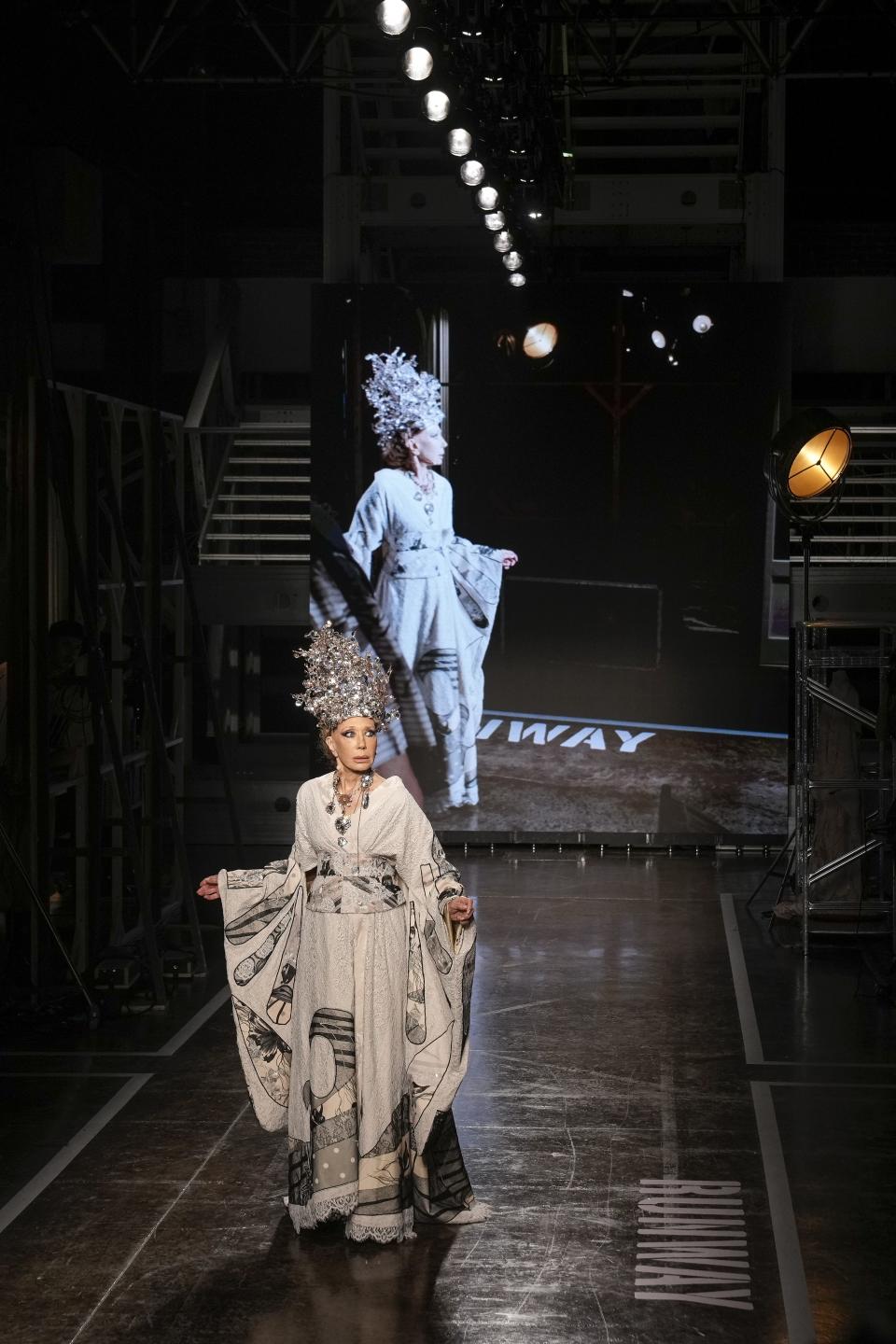 Marisa Berenson wears a creation as part of the Antonio Marras women's Spring Summer 2024 collection presented in Milan, Italy, Wednesday, Sept. 20, 2023. (AP Photo/Antonio Calanni)