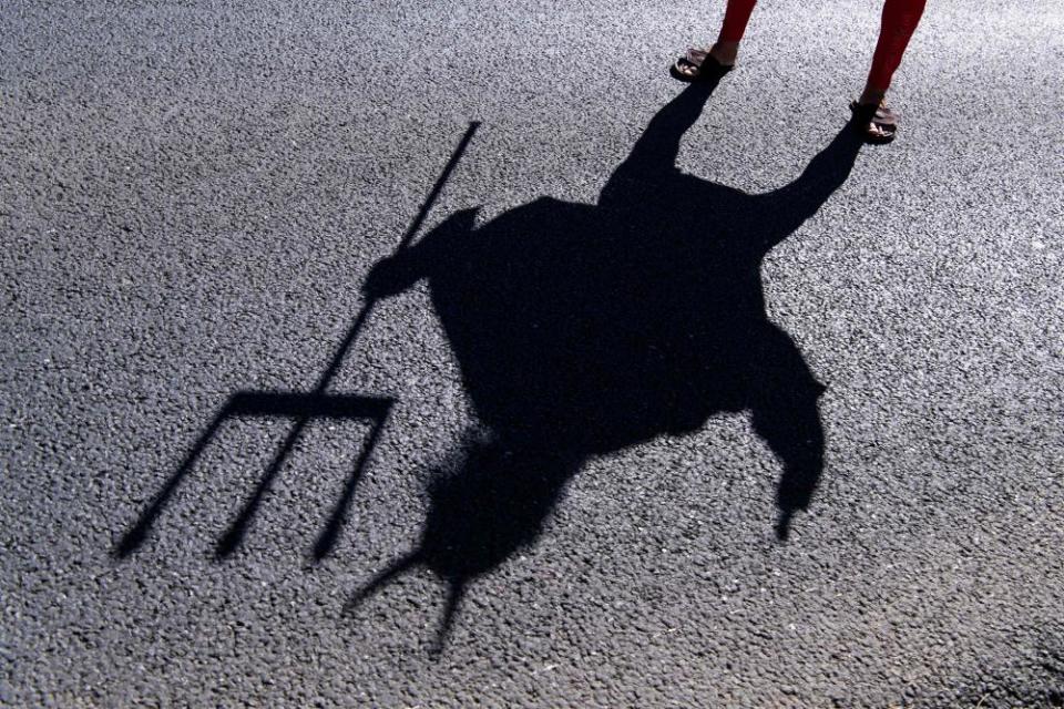 Cycling fan Didi Senft, aka El Diablo, poses for a picture as he waits for the riders during the Stage 7 between Millau and Lavaur.