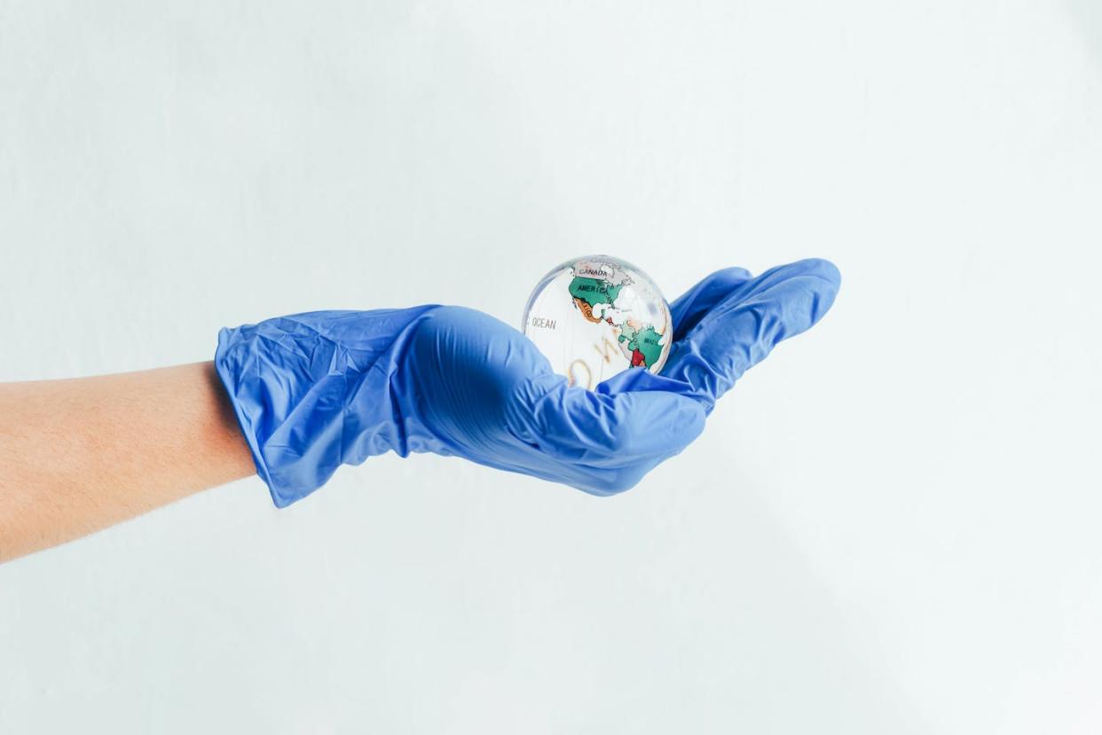 Effective collaboration requires addressing hierarchical mindsets. <a href="https://www.gettyimages.com/detail/photo/hand-in-a-medical-glove-holds-a-glass-globe-royalty-free-image/1223254880" rel="nofollow noopener" target="_blank" data-ylk="slk:Maryna Terletska/Moment via Getty Images;elm:context_link;itc:0;sec:content-canvas" class="link ">Maryna Terletska/Moment via Getty Images</a>