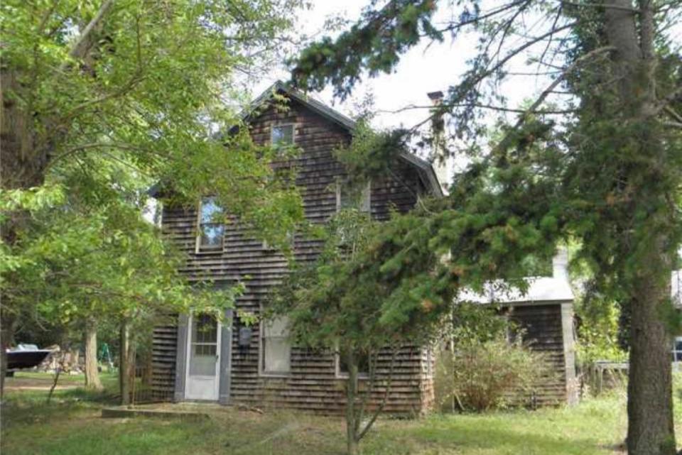 Side of house with gray wood shingles