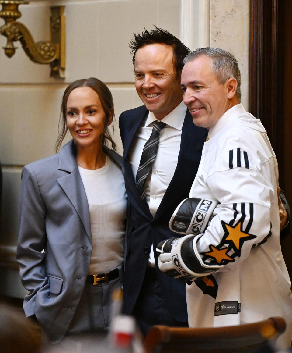 Utah Jazz owner Ryan Smith and his wife Ashley Smith pose for photos with Sen. Daniel McCay, R-Riverton, in the Senate as the SJR12 resolution on bringing an NHL hockey franchise to Utah is voted on at the Capitol in Salt Lake City on Monday, Jan. 29, 2024. | Scott G Winterton, Deseret News