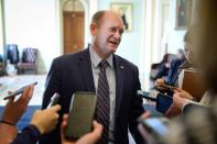 Sen. Chris Coons (D-DE) talks to media near the Senate floor during a brief recess from the day's Senate impeachment trial of President Donald Trump in Washington