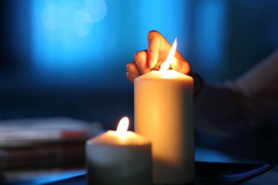 Lighting candles in the dark