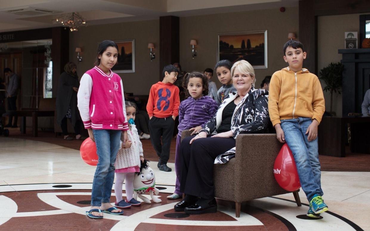 Jackie Mullen and some of the Syrian residents at Abbeyfield Hotel - Patrick Bolger Photography