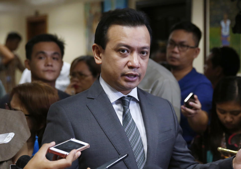 Philippine opposition Sen. Antonio Trillanes IV talks to the media outside his office in the Philippine Senate after posting bail following a regional trial court ordered his arrest Tuesday, Sept. 25, 2018 in suburban Pasay city, south of Manila, Philippines. Trillanes IV vowed to remain holed up in his office at the Senate until he is cleared of all the charges against him after President Rodrigo Duterte voided an amnesty given to the former rebel military officer. (AP Photo/Bullit Marquez)